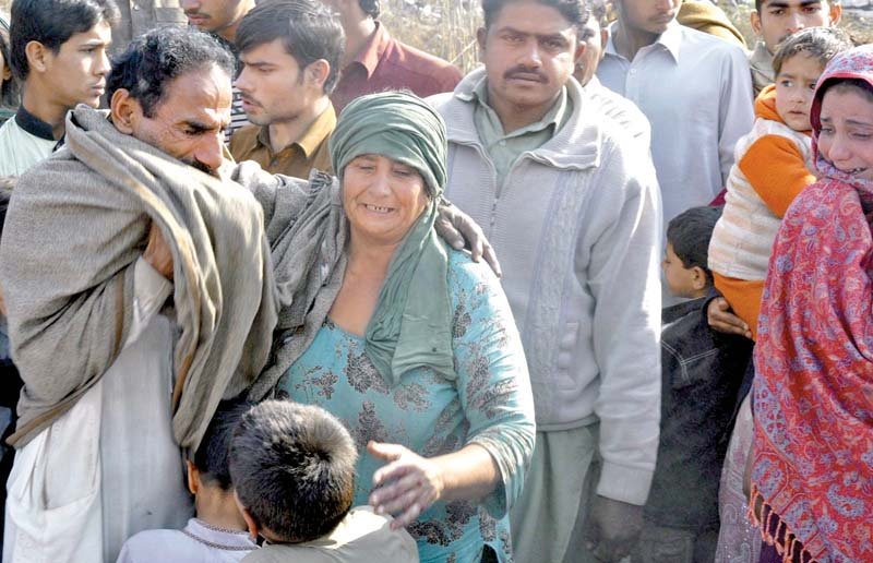 relatives of the deceased console each other photo inp