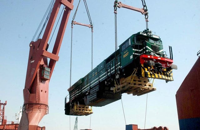 a newly inducted ge locomotive is being offloaded at the karachi port on monday photo app