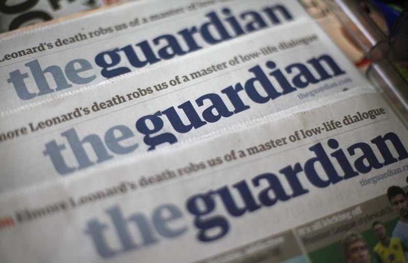 copies of the guardian newspaper displayed photo reuters