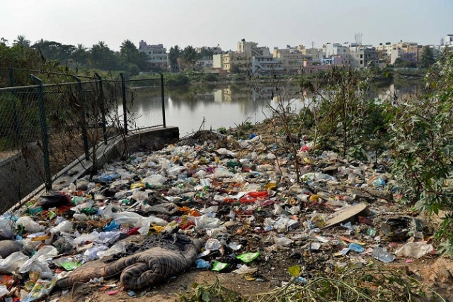 this photo taken on january 10 2017 shows garbage dumped by a lake in bangalore photo afp this photo taken on january 10 2017 shows garbage dumped by a lake in bangalore photo afp