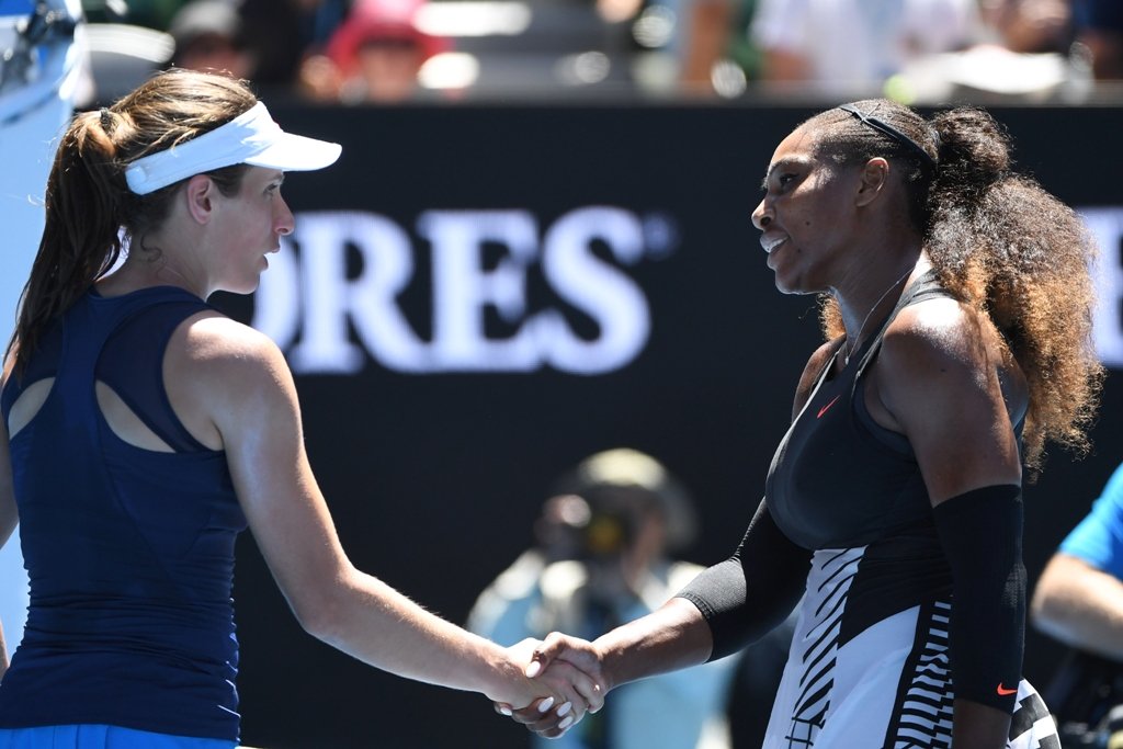 serena williams r shakes hands with johanna konta after winning their women 039 s singles quarter final on january 25 2017 photo afp