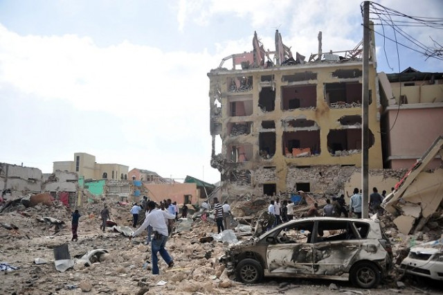 people react and walk among rubbles following an attack outside an hotel on january 25 2017 in mogadishu at least seven people were killed after two car bombs exploded outside a popular mogadishu hotel and gunmen forced their way inside the building and opened fire police said photo afp people react and walk among rubbles following an attack outside an hotel on january 25 2017 in mogadishu at least seven people were killed after two car bombs exploded outside a popular mogadishu hotel and gunmen forced their way inside the building and opened fire police said photo afp
