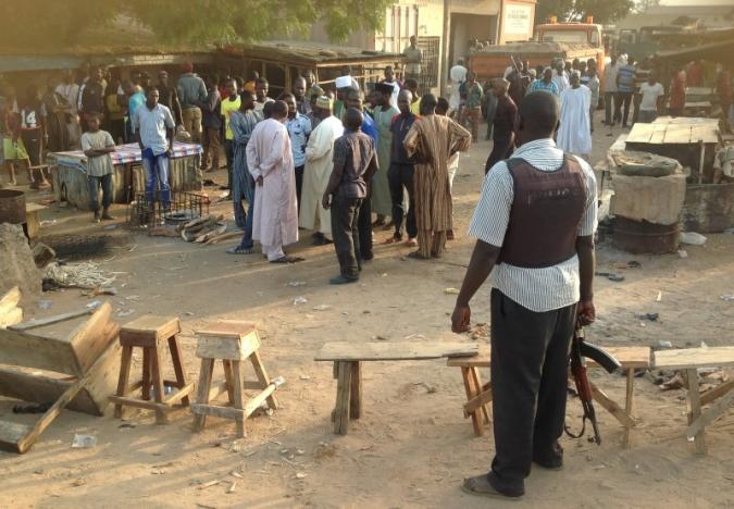 people gather at the scene of a bomb blast at a fruit and vegetable market in the jimeta area of yola adamawa nigeria november 18 2015 photo reuters