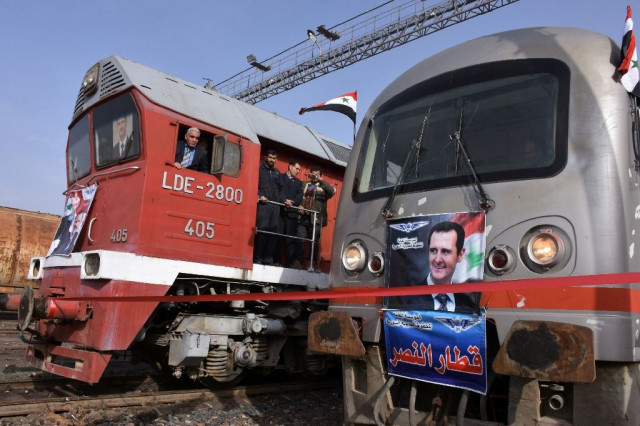 syrian railway workers wait for a train to leave aleppo 039 s jibreen station on the city 039 s eastern outskirts for a one hour round trip on january 25 2017 photo afp