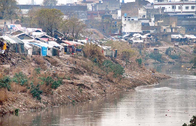 nullah leh flows along a slum in rawalpindi photo online