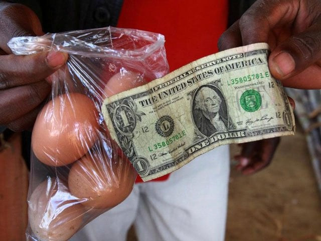 a man buy eggs using a us one dollar bill at a market in harare zimbabwe june 17 2010 photo reuters a man buy eggs using a us one dollar bill at a market in harare zimbabwe june 17 2010 photo reuters