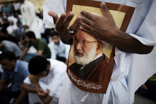 bahraini demonstrators attend a protest against the revocation of the citizenship of top bahraini shia cleric sheikh isa qassim portrait photo afp