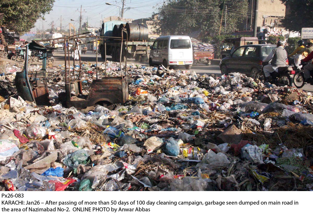 after passing of more than 50 days of 100 days cleaning campaign garbage seen dumped on the main road of nazimabad karachi photo online