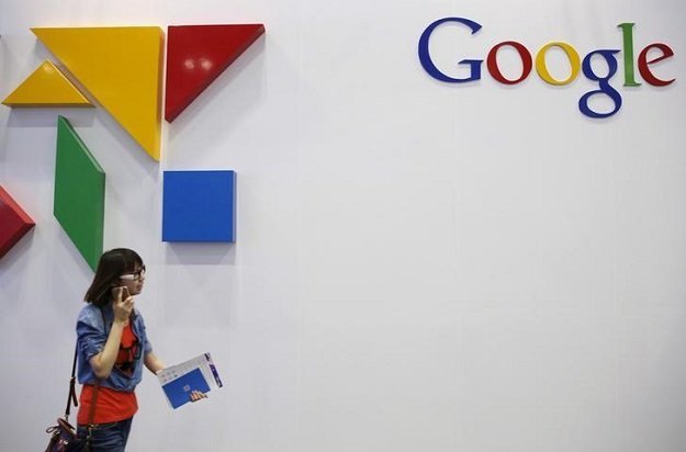 a woman walks past a logo of google at the global mobile internet conference gmic 2015 in beijing china april 28 2015 photo reuters