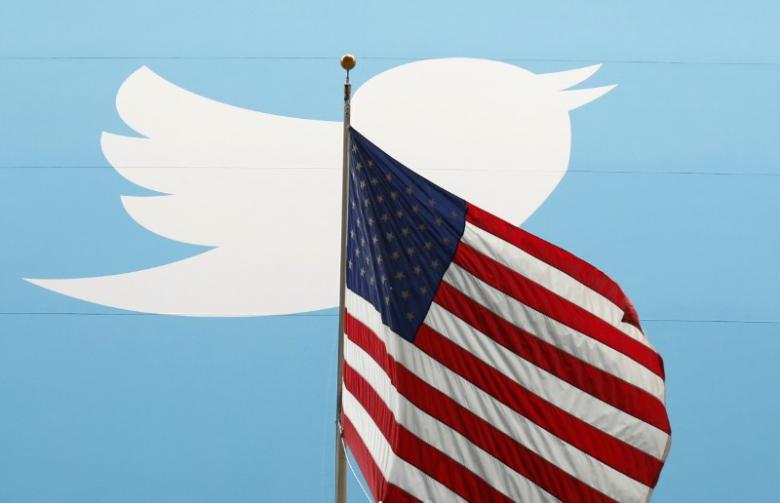 the twitter inc logo is shown with the u s flag during the company 039 s ipo on the floor of the new york stock exchange in new york photo reuters