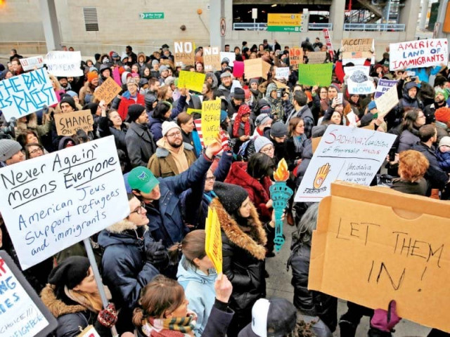 people protest trump s immigration ban outside new york s jfk airport photo reuters people protest trump s immigration ban outside new york s jfk airport photo reuters
