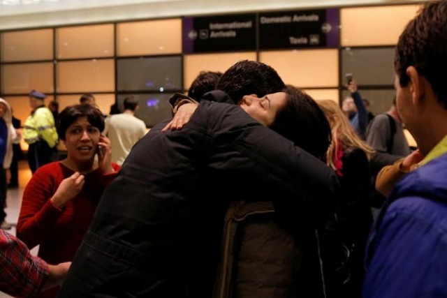 mazdak tootkaboni l is reunited with friends and family after he was separated from other passengers and questioned as a result of u s donald trump 039 s executive order travel ban at logan airport in boston massachusetts u s january 28 2017 tootkaboni an iranian with a u s green card is a professor at the university of massachusetts dartmouth umass photo reuters mazdak tootkaboni l is reunited with friends and family after he was separated from other passengers and questioned as a result of u s donald trump 039 s executive order travel ban at logan airport in boston massachusetts u s january 28 2017 tootkaboni an iranian with a u s green card is a professor at the university of massachusetts dartmouth umass photo reuters