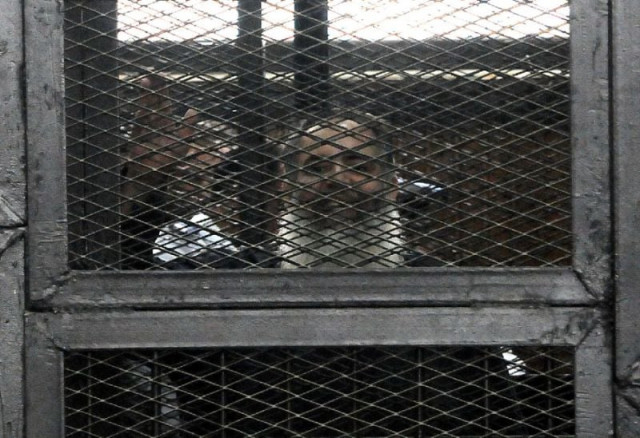 salafi politician hazem salah abu ismail waves from inside the defendants cage during his trial in the egyptian capital cairo on april 16 2014 photo afp salafi politician hazem salah abu ismail waves from inside the defendants cage during his trial in the egyptian capital cairo on april 16 2014 photo afp