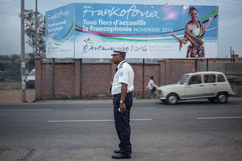 a malagasy traffic policeman directs the traffic on the outskirts of antananarivo on november 24 2016 photo afp