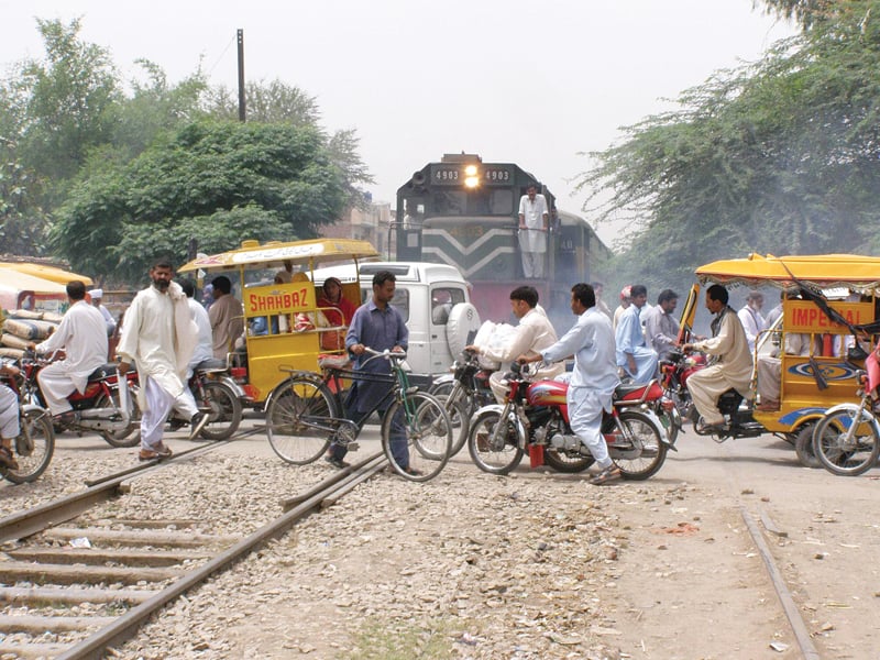 people cross unmanned railway crossings in sargodha and gujranwala photos online