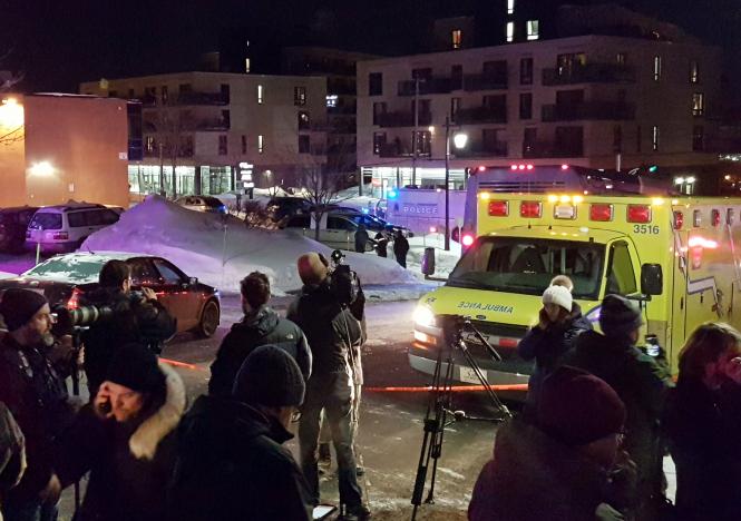 an ambulance is parked at the scene of a fatal shooting at the quebec islamic cultural centre in quebec city canada january 29 2017 reuters mathieu belanger