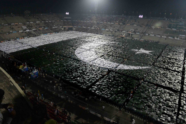 pakistani youths make the biggest human national flag at the national hockey stadium in lahore on october 22 2012 photo afp pakistani youths make the biggest human national flag at the national hockey stadium in lahore on october 22 2012 photo afp