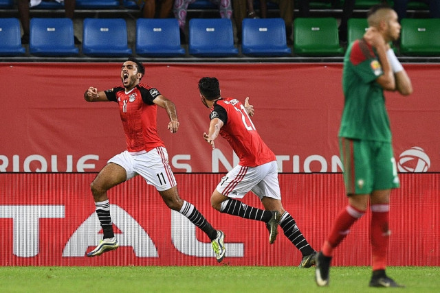egypt 039 s midfielder mahmoud abdel moneim l celebrates with mahmoud hassan in port gentil on january 29 2017 photo afp