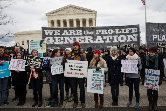 pro life demonstrators protest in front of the us supreme court in washington dc on january 27 2017 photo afp pro life demonstrators protest in front of the us supreme court in washington dc on january 27 2017 photo afp