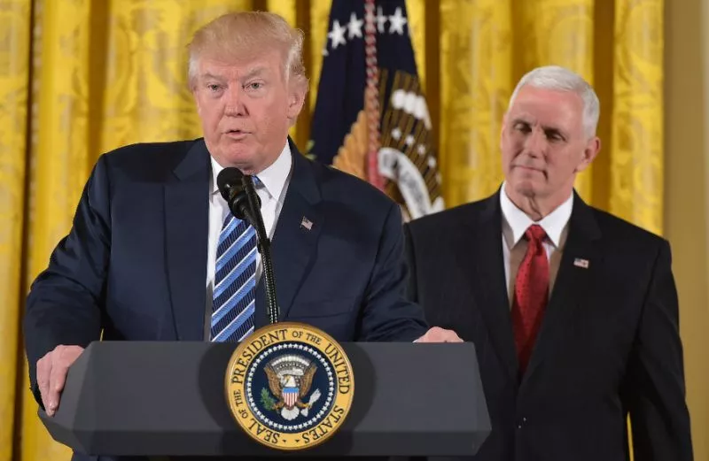 us president donald trump speaks as vice president mike pence watches photo afp us president donald trump speaks as vice president mike pence watches photo afp
