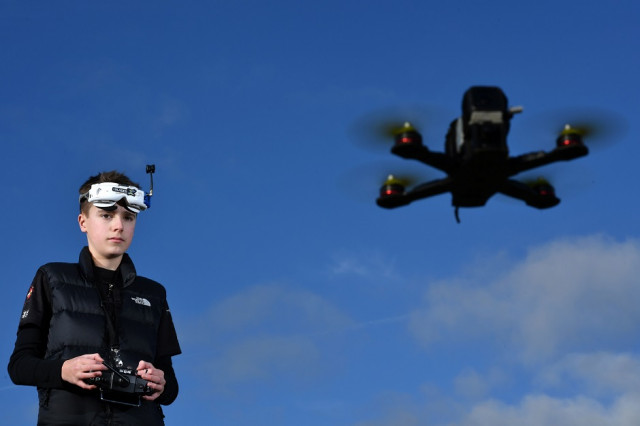 drone racing champion luke bannister poses for a photograph as he flies his first person view fpv drone in wiltshire western england on december 22 2016 photo afp drone racing champion luke bannister poses for a photograph as he flies his first person view fpv drone in wiltshire western england on december 22 2016 photo afp