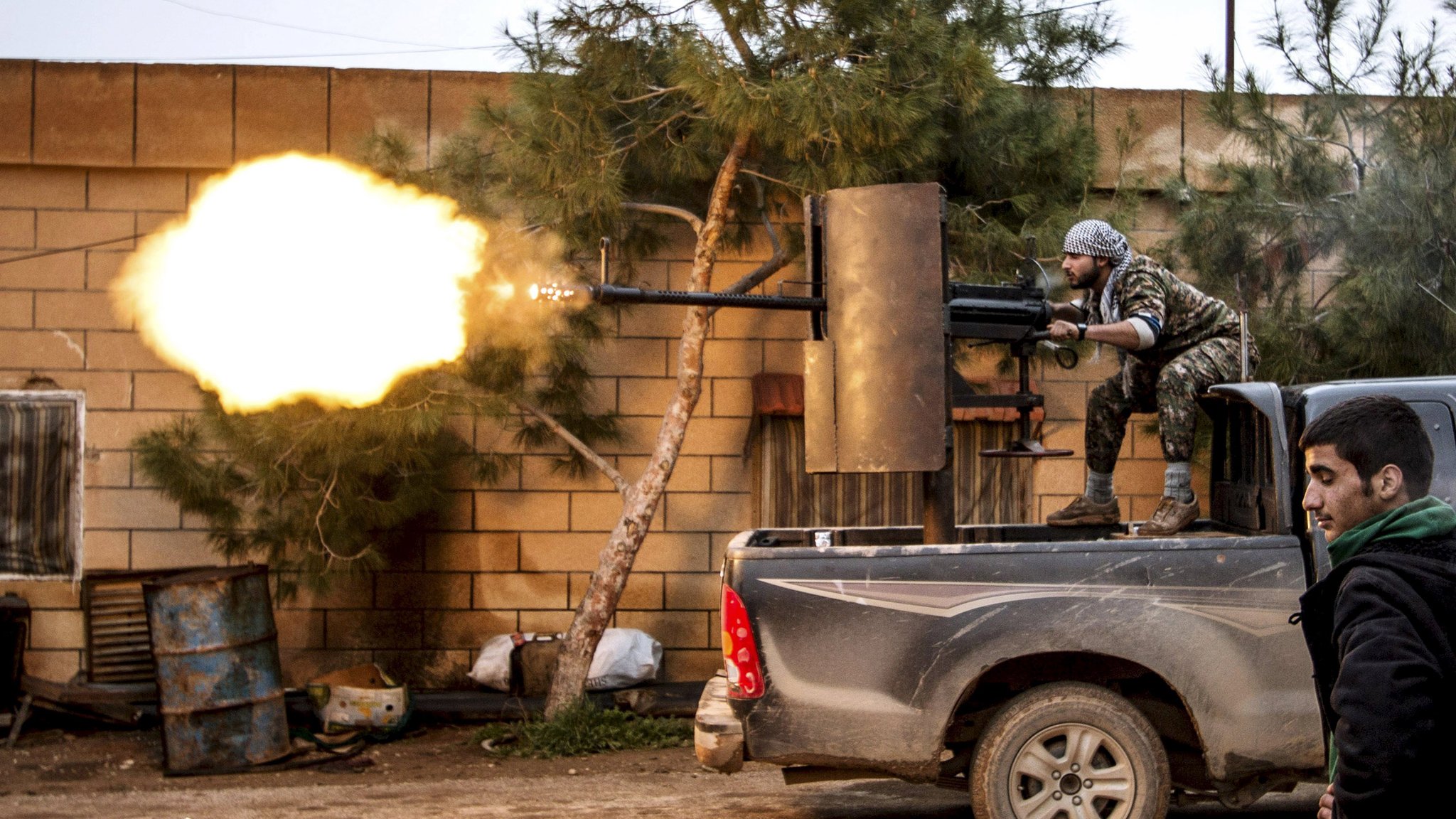 a kurdish people 039 s protection units ypg fighter fires an anti aircraft weapon at islamic state fighters in tel tawil village syria in this february 25 2015 file photo a conference underway in kurdish controlled northern syria aims to approve a quot federal democratic quot system of government for the area photo reuters