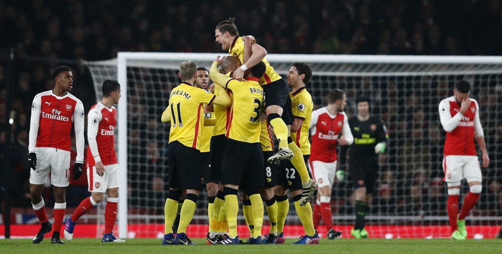 watford 039 s younes kaboul is mobbed by teammates as he celebrates scoring his team 039 s first goal against arsenal at the emirates stadium in london on january 31 2017 photo afp