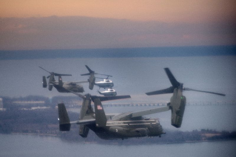 marine one carrying us president donald trump is escorted to dover air force base for the repatriation of navy seal team chief special warfare operator william quot ryan quot owens killed in a commando raid in yemen photo afp