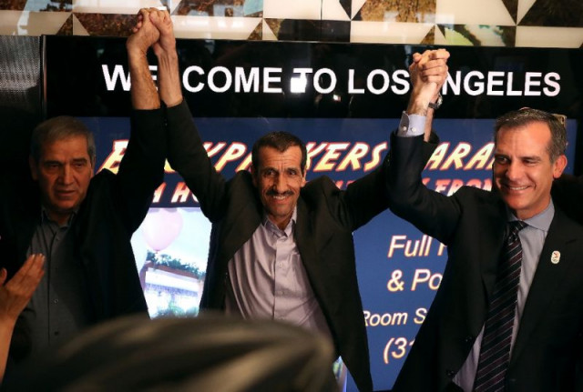 iranian citizen ali vayeghan c stands with his brother hossein vayeghan l and los angeles mayor eric garcetti as he arrives at los angeles international airport on february 2 2017 photo afp iranian citizen ali vayeghan c stands with his brother hossein vayeghan l and los angeles mayor eric garcetti as he arrives at los angeles international airport on february 2 2017 photo afp