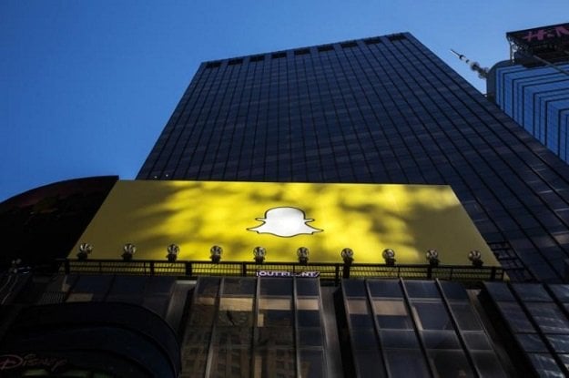 a billboard displays the logo of snapchat above times square in new york march 12 2015 photo reuters