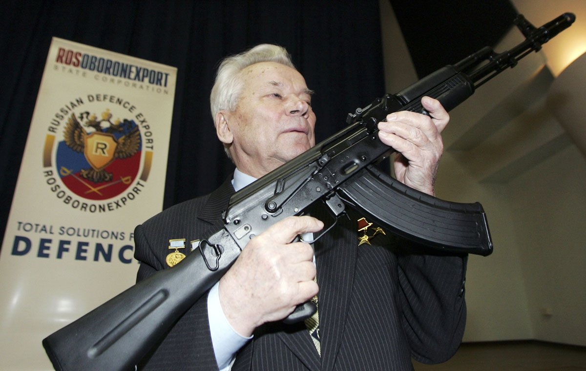 mikhail kalashnikov chief designer of the ak 47 assault rifle poses with the latest model the ak 103 during a news conference in moscow in this april 15 2006 file photo photo reuters