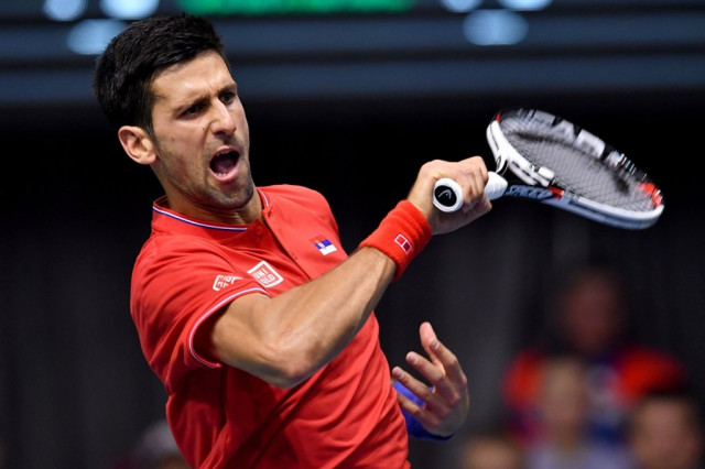 djokovic returns the ball to medvedev at cair sports hall in nis on february 3 2017 photo afp djokovic returns the ball to medvedev at cair sports hall in nis on february 3 2017 photo afp