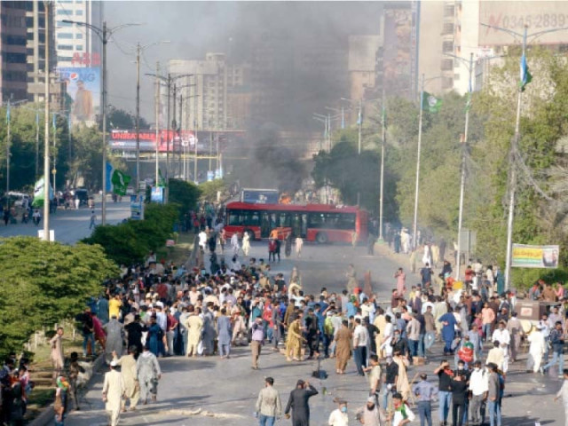smoke rises from a prison van torched by protestors on sharae faisal while women wash their eyes to soothe the effects of tear gas photos jala qureshi express smoke rises from a prison van torched by protestors on sharae faisal while women wash their eyes to soothe the effects of tear gas photos jala qureshi express