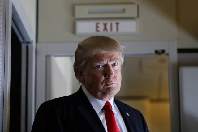 u s president donald trump pauses as he talks to journalists who are members of the white house travel pool on board air force one during his flight to palm beach florida while over south carolina us february 3 2017 photo reuters