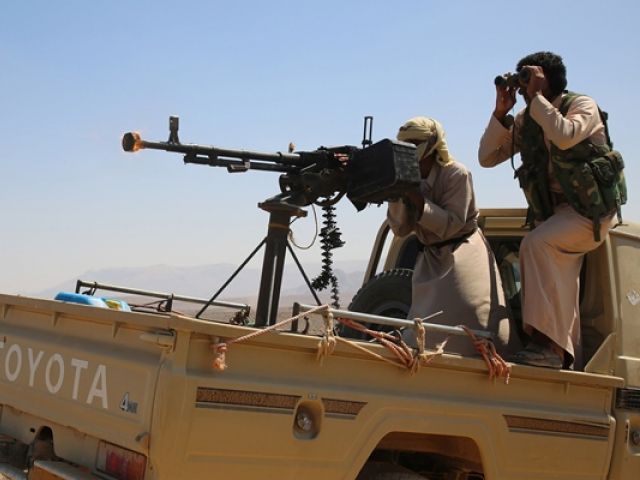 armed yemeni tribesmen supporting forces loyal to yemen 039 s saudi backed president fire from an armoured vehicle in the area of sirwah west of marib city on november 8 2015 photo afp