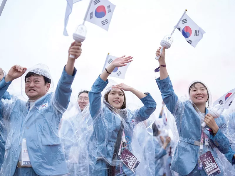 south korea s delegation erroneously introduced as north koreans sail in a boat along the river seine during the opening ceremony on friday photo afp south korea s delegation erroneously introduced as north koreans sail in a boat along the river seine during the opening ceremony on friday photo afp
