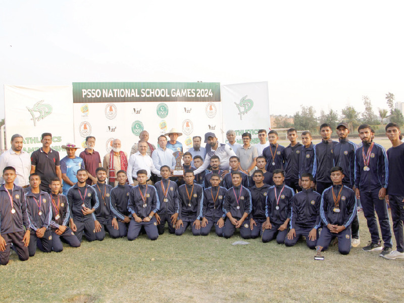 the cadet college petaro athletics team pose for a group photo with the chief guest and guests of honour after winning the under 15 under 17 and under 19 boys athletics titles photo app