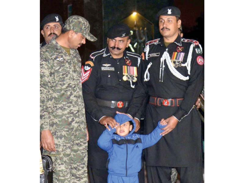 pakistan rangers receive five year old iftikhar ahmed at the wagah border photo app