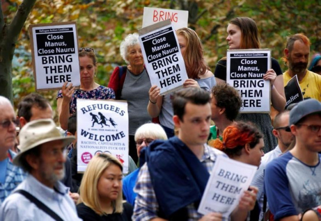 protesters from the refugee action coalition hold placards during a demonstration outside the offices of the australian government department of immigration and border protection in sydney australia photo afp protesters from the refugee action coalition hold placards during a demonstration outside the offices of the australian government department of immigration and border protection in sydney australia photo afp