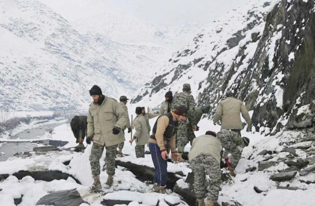 chitral scouts conduct a rescue operation in an avalanche hit area photo inp chitral scouts conduct a rescue operation in an avalanche hit area photo inp