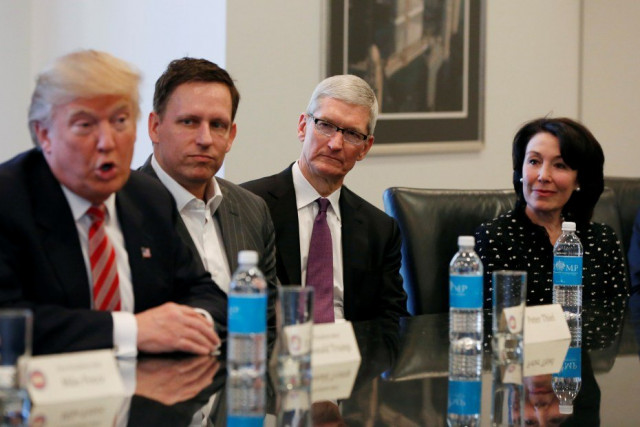 us president elect donald trump speaks as paypal co founder and facebook board member peter thiel apple inc ceo tim cook and oracle ceo safra catz look on during a meeting with technology leaders at trump tower in new york photo reuters us president elect donald trump speaks as paypal co founder and facebook board member peter thiel apple inc ceo tim cook and oracle ceo safra catz look on during a meeting with technology leaders at trump tower in new york photo reuters