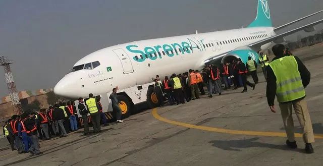 the serene air jet is being pulled by the tug machine at islamabad airport photo inp the serene air jet is being pulled by the tug machine at islamabad airport photo inp