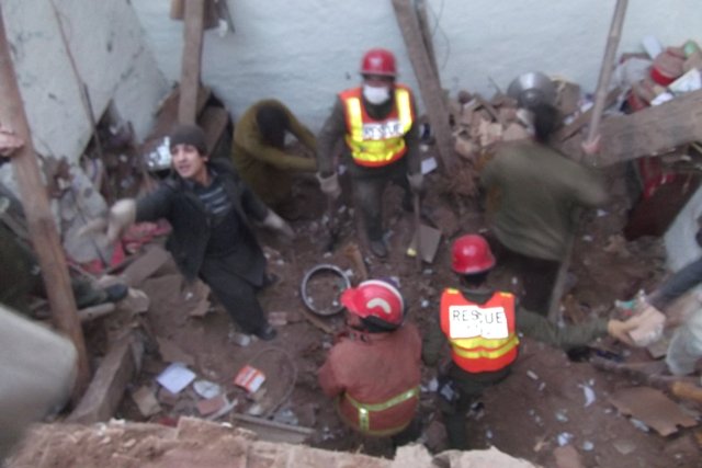 seven people including women and children were killed when the roof of a house collapsed photo rescue 1122