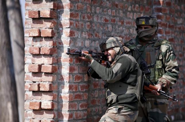 indian army soldiers take their positions near the site of a gun battle between indian security forces and militants on the outskirts of srinagar february 21 2016 photo reuters