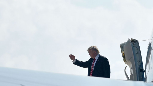 us president donald trump salutes before boarding air force one from macdill air force base on february 6 2017 in tampa florida photo afp us president donald trump salutes before boarding air force one from macdill air force base on february 6 2017 in tampa florida photo afp
