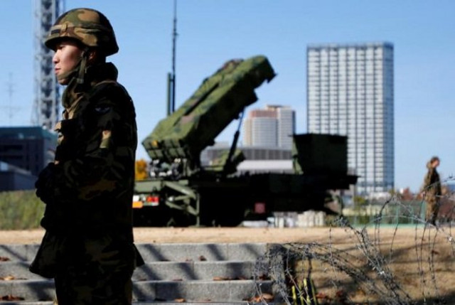 members of the japan self defence forces stand guard near patriot advanced capability 3 pac 3 land to air missiles deployed at the defense ministry in tokyo japan december 7 2012 photo reuters members of the japan self defence forces stand guard near patriot advanced capability 3 pac 3 land to air missiles deployed at the defense ministry in tokyo japan december 7 2012 photo reuters