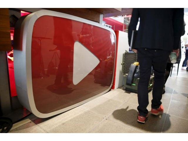 a man walks past a youtube logo at the youtube space la in playa del rey los angeles california united states october 21 2015 photo reuters