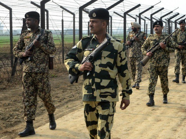 indian border security force soldiers patrol along the india pakistan border fence about 27 km from wagah on january 13 2013 photo afp