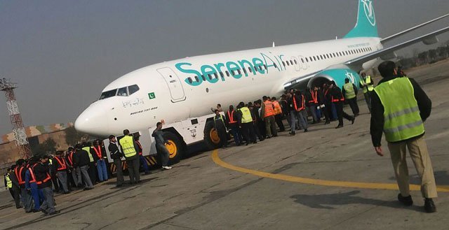 the serene air jet is being pulled by the tug machine at islamabad airport photo inp