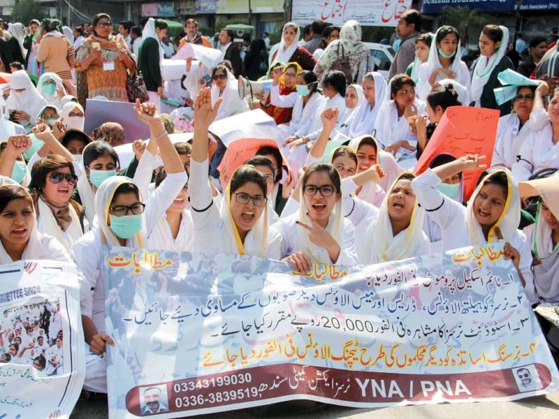 nursing staff and members of young nurses association and provincial nurses association protest outside karachi press club on tuesday photo ayesha mir express